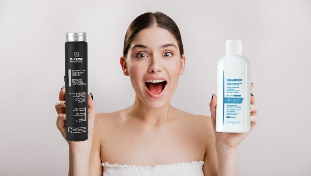 Femme tenant un shampoing cheveux gras des marques Ducray et K-Reine
